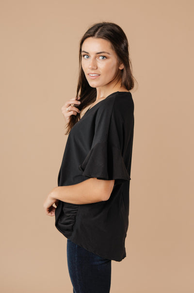 Nice Surprise Surplice Knit Top In Black