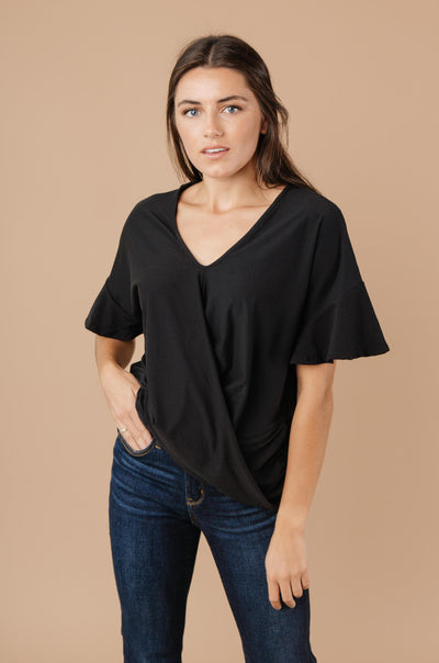 Nice Surprise Surplice Knit Top In Black